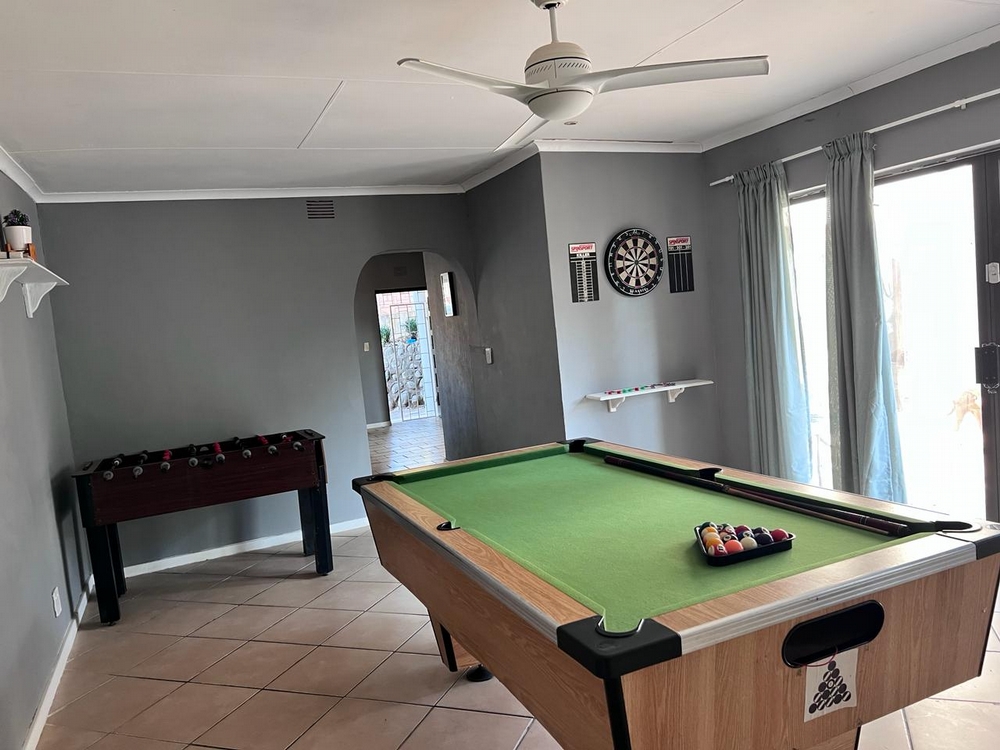 Deja Blu: Entertainment area with pool table, foosball table and dart board.